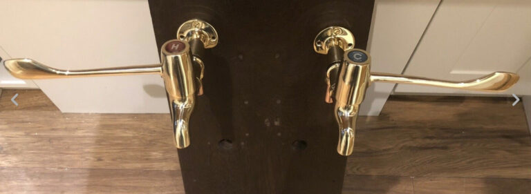 Read more about the article Armitage Shanks lever-action bib taps in polished brass.